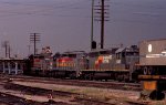 SBD 1239 leads a northbound piggyback train across Peace Street